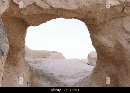 Hole in limestone rock light color closeup Stock Photo
