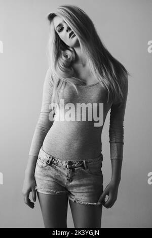 Be-you-tiful. Black and white image of a beautiful young woman posing in a studio. Stock Photo