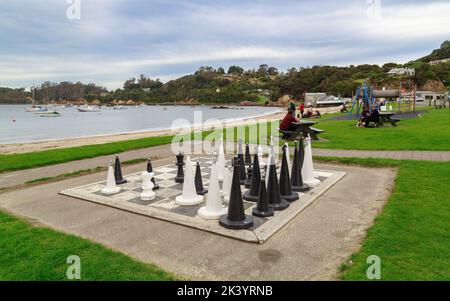 Stewart Island, New Zealand. A giant public chess game on the waterfront in the town of Oban Stock Photo