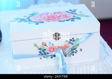 Wedding decorative box with roses bouquet. Box for money Stock Photo