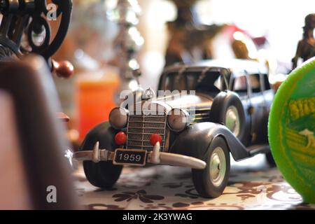 Mini vintage car model in a boutique. Stock Photo