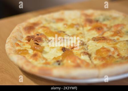 Pizza with four kinds of cheese. Italian pizza. Pizza quattro formaggi. Stock Photo