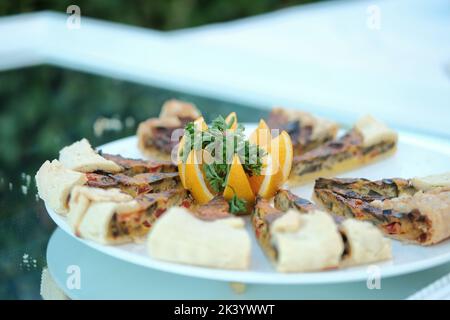 Salted tart with meat and vegetables. Stock Photo