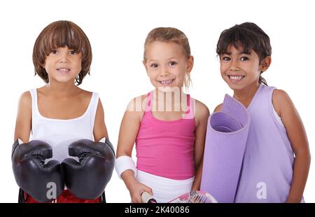 When I grow up I want to be a...Studio shot of a group of children in various sports attire. Stock Photo