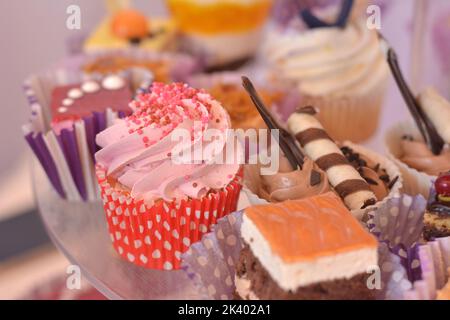 Strawberry cream muffin and peach cake and chocolate crunch Stock Photo