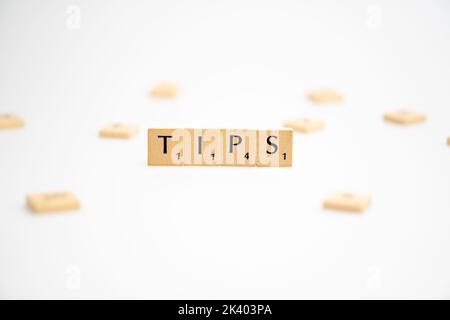 TIPS word written on white background. TIPS text on white for your designs, concept. Stock Photo