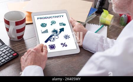 Productivity concept shown on a tablet held by a man Stock Photo