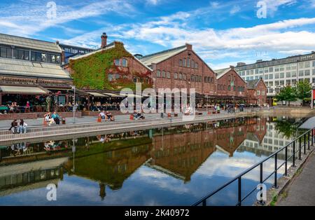 TMV-Kaia, an old shipyard area with warehouses, now a popular meeting point with restaurants and cafes in Trondheim, Norway. Stock Photo