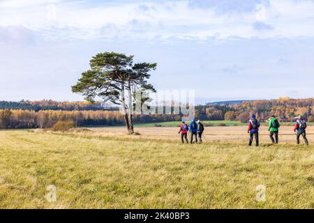 People walking in a rural landscape at autumn Stock Photo