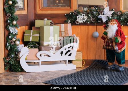 Christmas decoration. Plenty of colorful christmas presents under the fir-tree. Magical time, surprises, festive atmosphere. Stock Photo