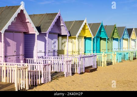 Mersea Island beach huts row of colourful beach huts Mersea Island beach West mersea Island Essex England UK GB Europe Stock Photo