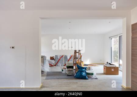 Furniture and tools are in the large passage room when the house is renovated Stock Photo