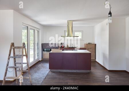 Kitchen island in kitchen during painting work in a new house Stock Photo