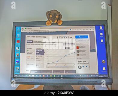 Ģ����ý website on a  computer screen, sweden, with dog mascot. Stock Photo