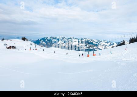 People on ski drag lift rope in winter resort during holiday vacation Stock Photo