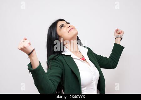 Excited happy woman with fists up isolated on white background Stock Photo