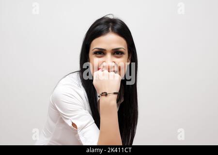 Excited happy woman with fists up isolated on white background Stock Photo