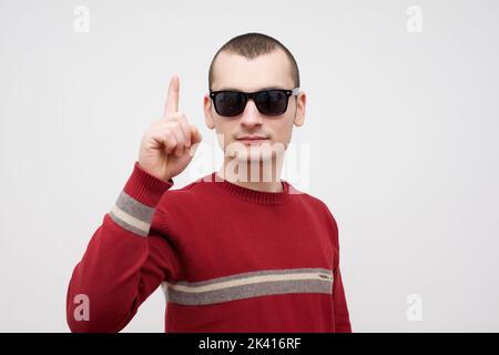 Young happy man with good idea sign in casuals isolated on white background stock photo Stock Photo