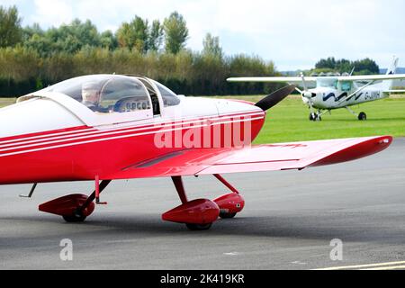 Vans RV-6A is a popular US kit built light aircraft design for recreational flying - in background is a Cessna 150 - UK airfield in 2022 Stock Photo