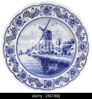 Old vintage blue and white ceramic plate with Dutch motifs as a souvenir
