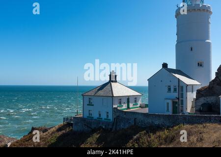 Start Point lighthouse and cottages overlooking Start Bay in the South Hams, Devon, UK Stock Photo