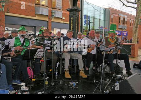 The Gathering, perform in Golden Square, Warrington, Cheshire, England, UK,  for St Patricks Day, March 2019 Stock Photo