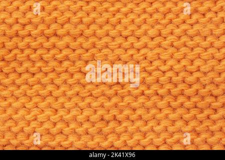 Knitted texture close-up, bright yellow color, background Stock Photo