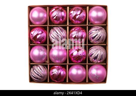 Pink glitter Christmas tree balls in cardboard craft box isolated on white background. Top view Stock Photo