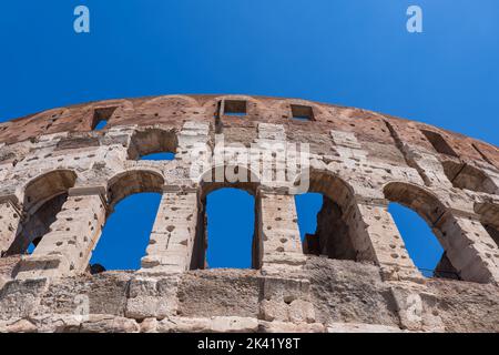 Colosseum architectural details in city of Rome, Italy, close-up to external wall, third and fourth levels of ancient Flavian Amphitheatre and gladiat Stock Photo