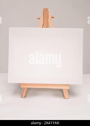 Close up of white empty easel for incriptions and pictures . High quality photo Stock Photo