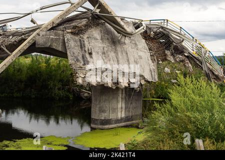 Irpin, Kyiv region, Ukraine - August 21. 2022: A bridge destroyed by the Ukrainian Armed Forces near the town of Irpen to stop the passage of troops Stock Photo