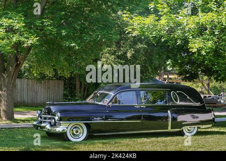 FLINT, MI/USA - JUNE 22, 2019: A Miller Cadillac hearse, Sloan Museum Auto Fair car show, Crossroads Village, near Flint, Michigan. Stock Photo