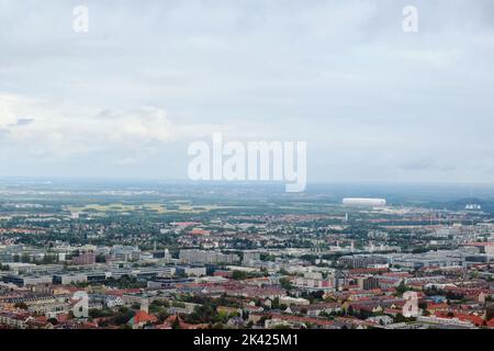 Panoramic view of Munich city at a rainy day. Wind turbines and Allianz arena stadium at the background. Munich, Bavaria, Germany Stock Photo