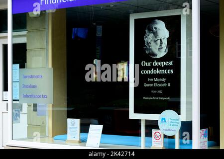 Tribute on Queen's death (poignant electronic digital shop front image, Elizabeth 2 II face, remembering commemorating, paying respects) - England UK.