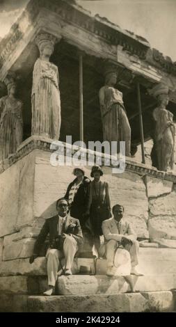 Tourists next to the Porch of the Caryatids in the Erechtheion on the Acropolis of Athens, Greece, 1920s Stock Photo