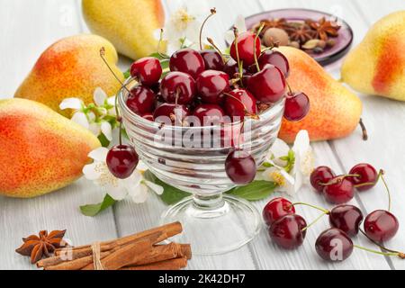 red cherries on wood background Stock Photo