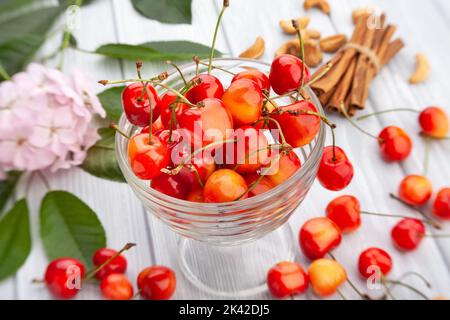 red yellow cherries on wood background Stock Photo