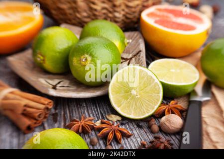 sliced lime on a plate on wood background Stock Photo