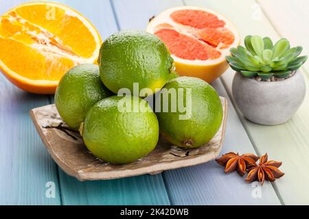 lime on a plate on wood background Stock Photo
