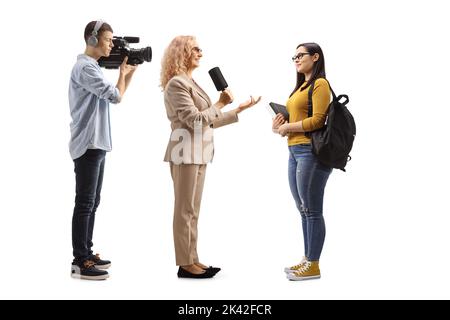 Female reporter interviewing a student and camera man recoridng isolated on white background Stock Photo