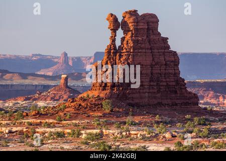 Thor's Hammer in the Land of Standing Rocks, Maze District, Canyonlands NP, Utah with the Candlestick Tower & Island in the Sky District behind. Stock Photo