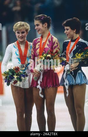 L-R Rosalynn Sumners (USA),Katarina Witt (GDR), Kira Ivanova (URS) Figure Skating Ladies' singles medalist at the 1984 Olympic Winter Games. Stock Photo