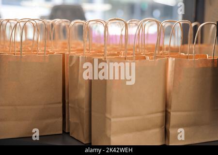 Many open shopping bags. Lots of craft packages. Business concept. Stock Photo