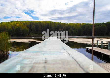 blue sky clear with perspective wooden bridge extending into the sea at resort,attractions place for relax in summer on holiday,vacation on island and Stock Photo