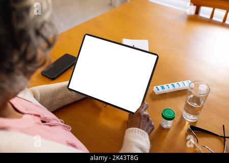 Senior african american woman using tablet with copy space Stock Photo