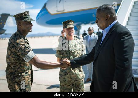 Secretary of Defense Lloyd J. Austin III greets Sgt. Maj. Lacey Lewis, and Col. Thomas Bedell, Commanding Officer, Miramar Marine Corps Air Station, Calif., Sept. 28, 2022. Austin was in California to visit unmanned surface vehicle techology at Naval Station Point Loma and visit Marines stationed on the base. (DoD photo by Chad J. McNeeley) Stock Photo