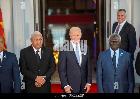 From left to right: Prime Minister of the Republic of Fiji Josaia Voreqe Bainimarama, President of the United States Joe Biden and Prime Minister of the Solomon Islands Manasseh Sogavare pose for a group photograph before dinner at the White House in Washington, DC on Thursday, September 29, 2022. Credit: Bonnie Cash/Pool via CNP Stock Photo