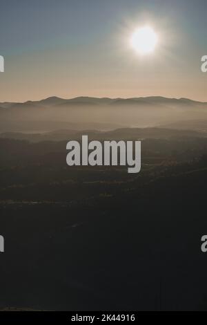 Sunrise in the Carpathian mountains. Autumn foggy landscape Stock Photo