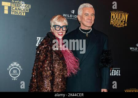 London, UK. 29th Sep, 2022. Filmmaker Baz Luhrmann (R) and his wife Catherine Martin (L) a film costume designer pose on the red carpet at a special Gala night at Moulin Rouge! The Musical in aid of Teenage Cancer Trust. With Baz Luhrmann hosting the night as his film comes to life onstage in London's West End at The Piccadilly Theatre. (Photo by Bonnie Britain/SOPA Images/Sipa USA) Credit: Sipa USA/Alamy Live News Stock Photo