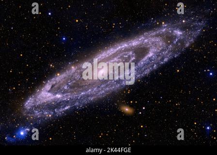 Spiral Galaxy M31, NGC 224, in Andromeda constellation. Violet filter, enhanced colors. Stock Photo